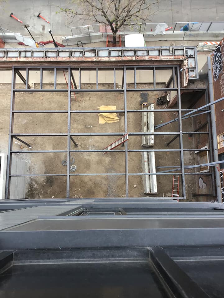 Steel beams are used as a foundation for building extensions.