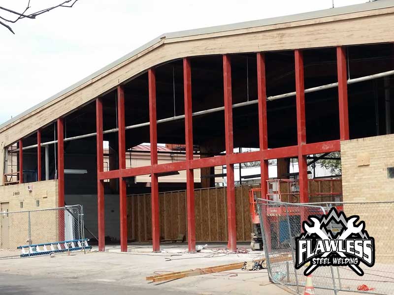 Front view of the Gym Project building during ongoing construction.