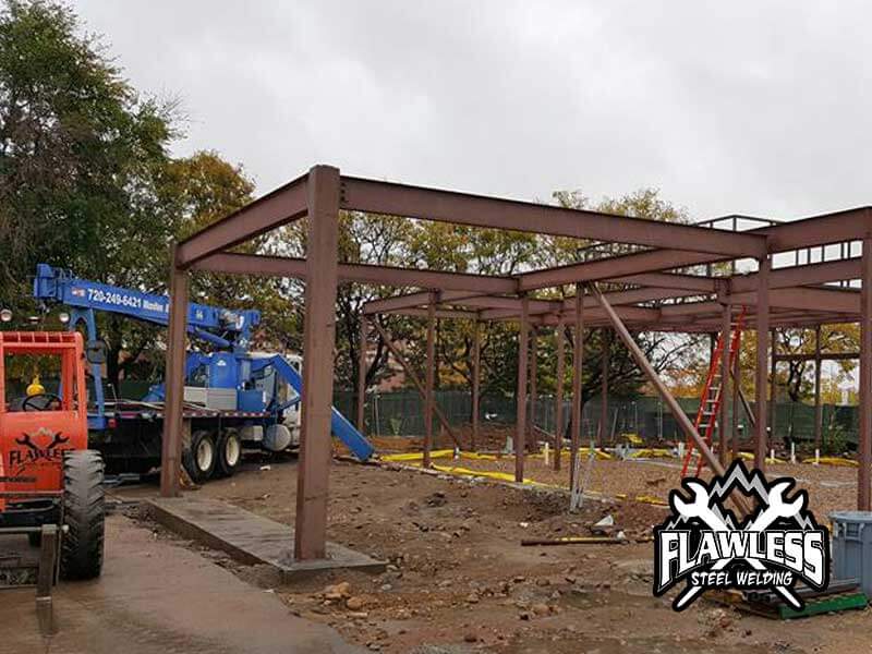 Steel beam structure and flawless steel welder equipment on a construction site.